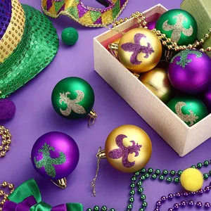 Close-up of Mardi Gras ornaments with glitter fleur-de-lis in purple, green, and gold