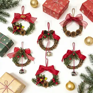 Detailed view of various Christmas wreaths with red bows, bells, and pinecones