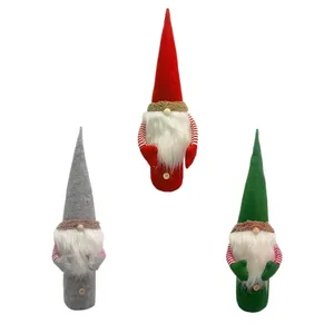 Set of three Christmas gnome wine bottle covers in red, green, and grey