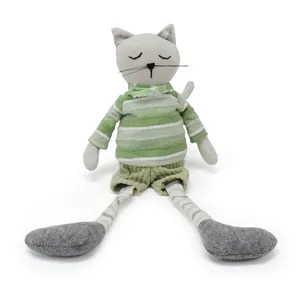 Handmade plush cat doll featuring green striped shirt and long legs on white background
