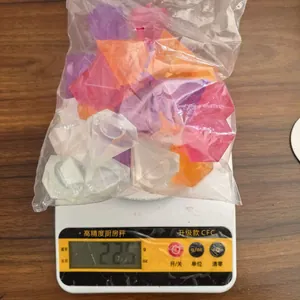 Detail view of a 225g bag of colorful diamond-shaped reusable plastic ice cubes