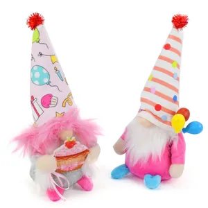 Detailed view of birthday themed gnome plush dolls with cupcake and balloon accents