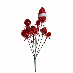 Detailed view of festive Christmas ball picks featuring a mini Santa hat and red ribbons