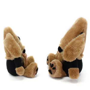 Side profile of cute brown plush dog gnome doll with long ears and paw details