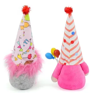 Detailed view of two cute pink plush birthday gnomes with party hats and balloons
