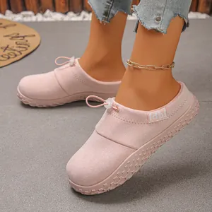 Women's pink suede slip-on shoes with adjustable drawstring and thick sole detail