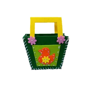 Handmade DIY felt handbag for kids featuring cartoon duck and floral decorative elements