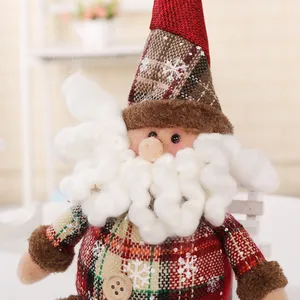 Close-up of Christmas plush doll with white curly beard and snowflake plaid pattern