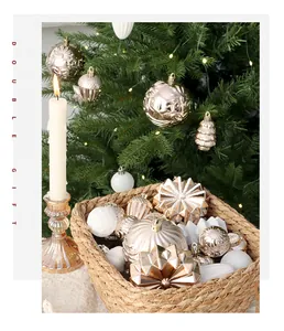 A variety of hand-painted champagne gold Christmas ornaments in a cozy holiday setting