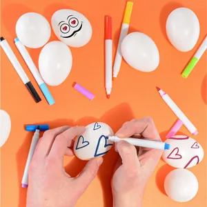 DIY Easter graffiti egg set featuring white hollow eggs and vibrant colorful markers