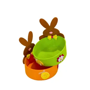Handmade colorful Easter felt rabbit baskets for egg storage and festive candy display