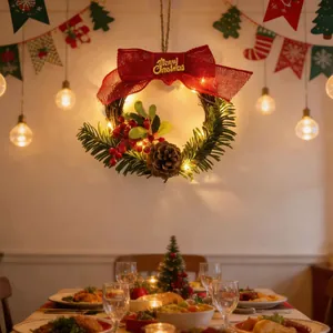 Detailed view of lighted Christmas wreath with red bow and pinecone decoration