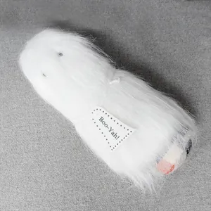 Detailed view of white long-haired Halloween ghost doll with a cute Boo-Yah! paper tag