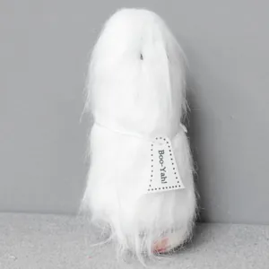 Detail view of a fluffy white long-haired Halloween ghost doll with Boo-Yah tag