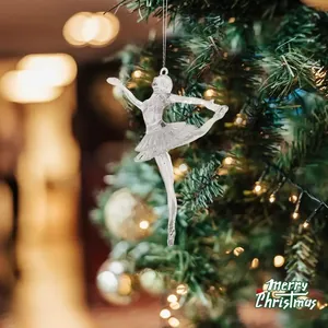 Transparent acrylic ballerina ornament hanging on a festive Christmas tree detail