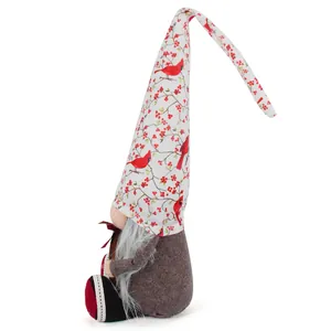 Detailed side view of Christmas gnome plush with red cardinal and berry pattern hat