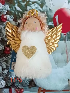 Close-up of white plush Christmas angel pendant with golden wings and heart