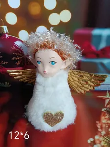Close-up of white plush angel girl ornament with golden wings for Christmas decor