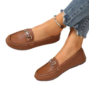 Classic brown faux leather loafers for women featuring a vintage metal buckle detail