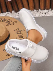 Close-up of white women's casual platform wedge slip-on shoes with drawstring detail