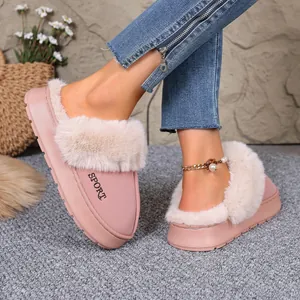 Detailed shot of pink winter house slippers featuring plush faux fur trim and SPORT embroidery
