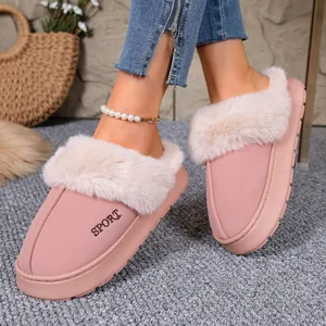 Cozy pink winter slippers with fluffy fur trim and sporty embroidery for women.