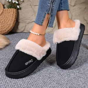 Detailed view of cozy winter slippers with plush fur lining and sport embroidery