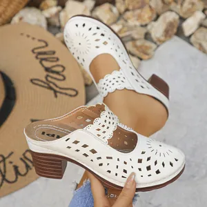 Detailed view of elegant white laser-cut hollow-out pattern on women chunky heel mules