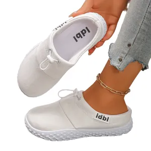 Comfortable white suede slip-on clogs for women featuring adjustable drawstring detail