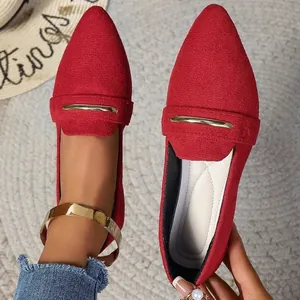 Elegant red suede-like pointed-toe flat loafers featuring a stylish gold metal bar accent