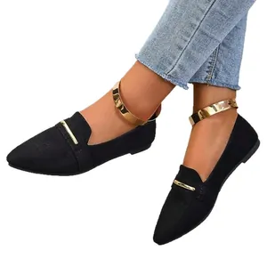 Elegant black pointed-toe flat loafers with gold metal strap and matching anklet