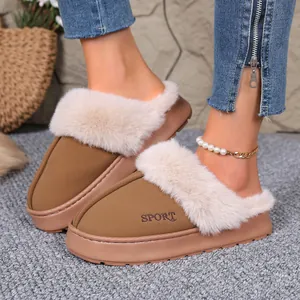 Close-up detail of khaki winter slippers with plush fur trim and thick platform sole