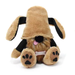 Front view of a brown plush dog gnome doll with floppy ears and paw prints