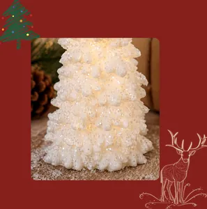 Close-up of a warm white LED resin Christmas tree lamp with glitter texture