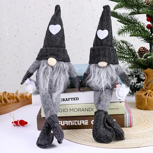 Two knitted faceless gnomes with long legs for Christmas home holiday decoration.