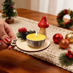 Close-up of a festive wooden mushroom candle holder with a lit tealight on a table