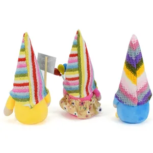 Back view of three colorful birthday gnomes featuring striped hats and tiny balloons.