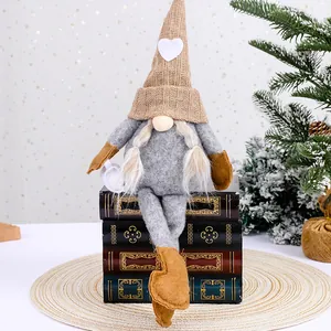 Handmade knitted faceless Christmas gnome doll with long legs and a heart pattern hat