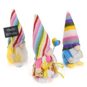 Three colorful birthday plush gnomes featuring rainbow striped hats and festive accessories