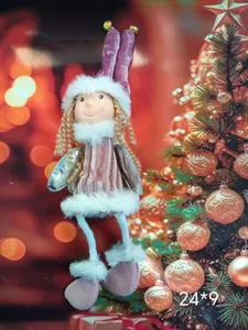 Close-up of a plush angel ornament with velvet hat and fur trim on a Christmas tree