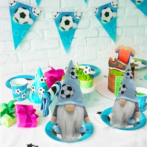 Detailed view of two plush soccer gnomes in a festive sports themed party setting.