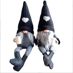 Pair of Christmas gnomes with knit hats and heart detail for holiday home decor.