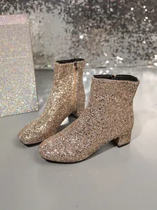 Detailed view of champagne gold sequin ankle boots with fashion chunky heel
