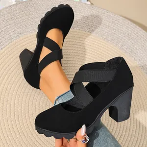 Detail of black thick heel platform shoes for women featuring elastic cross straps