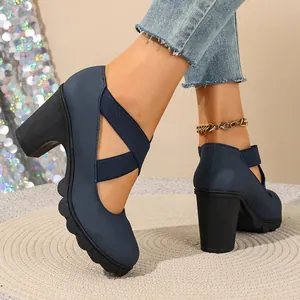 Side detail view of navy blue platform shoes with chunky block heels and cross straps.