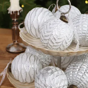 Elegant vintage white and silver Christmas bauble set with various textures and ribbons