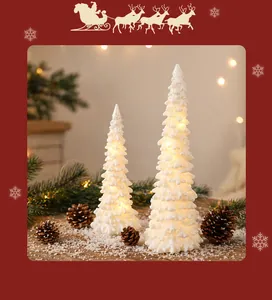 Detailed macro view of frosted white resin LED mini Christmas tree night light decoration