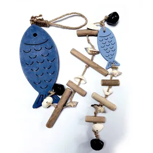 Detailed view of Mediterranean wooden fish hanging ornament with jute rope and shells