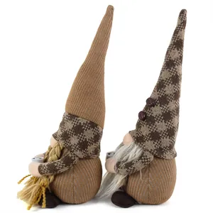 Pair of coffee-themed gnomes with knitted hats for coffee bar decor.