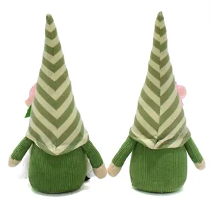 Detailed rear view of two green striped spring gnome plush dolls with pink flowers ornaments